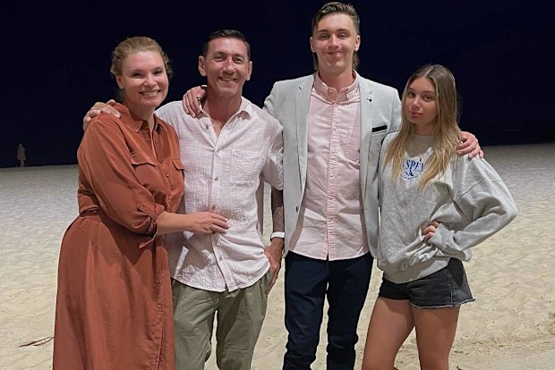 Chloe Maxwell with her partner and two children