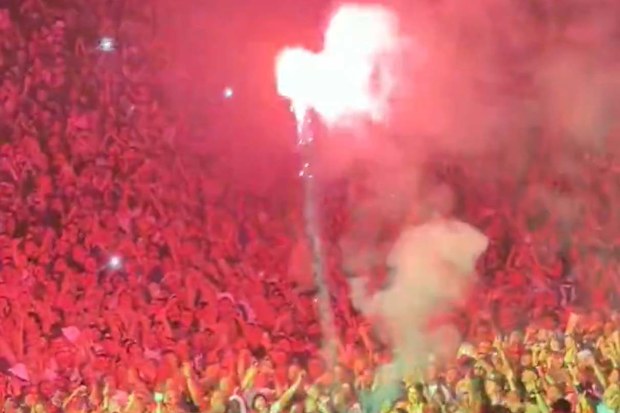 A flare was thrown at the first Oasis concert in Melbourne.