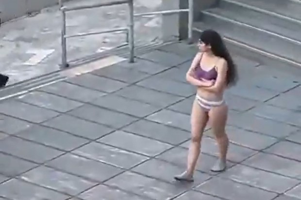 A female student stripped to her underwear outside her university in Iran in what some student and rights groups say was a protest against the country's strict Islamic dress code.