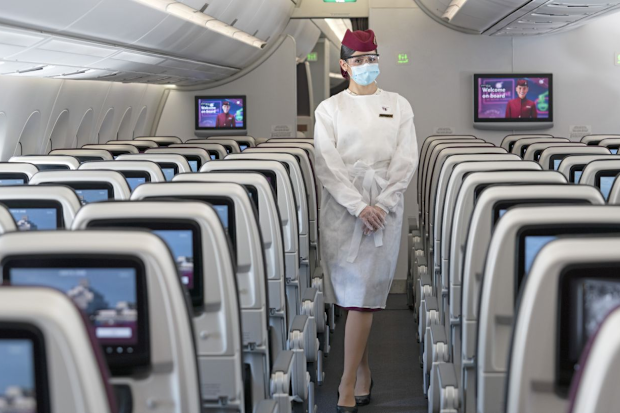 Qatar Airways coronavirus measures: cabin crew wear protective gowns, masks, glasses and gloves