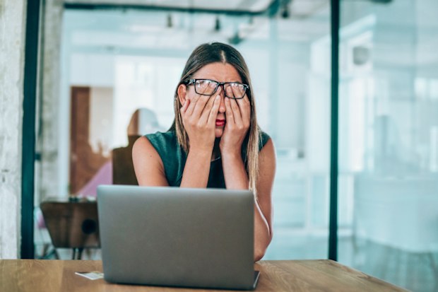 Woman stressed at work.