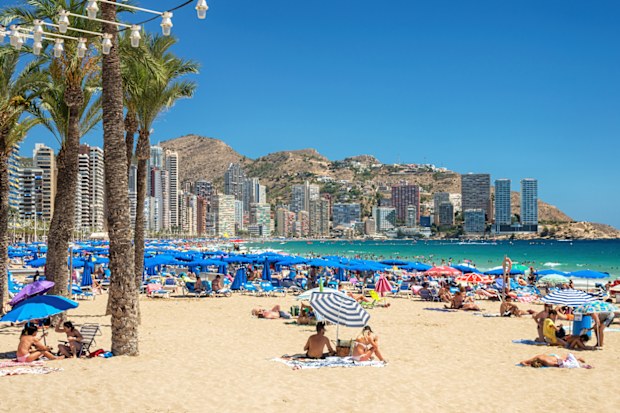 Beach of Benidorm - August 12, 2017: Crowded beach of Benidorm resort in Costa Blanca, Spain. Image, taken in 12/08/2017 at a beach of Benidorm, Costa Blanca, Comunidad de Valencia, Spain