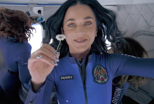 Katy Perry holds up a daisy during her flight to space with Blue Origin, April 2025
