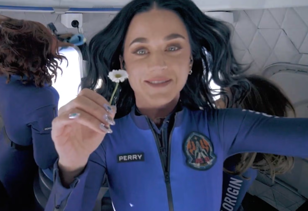 Katy Perry holds up a daisy during her flight to space with Blue Origin, April 2025
