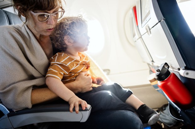 Mum and toddler on a flight, plane