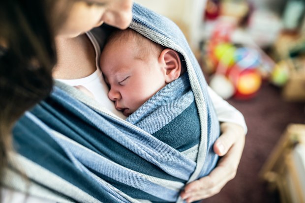Mother with baby in baby carrier