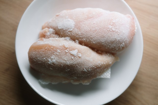 Frozen chicken breasts in a dish