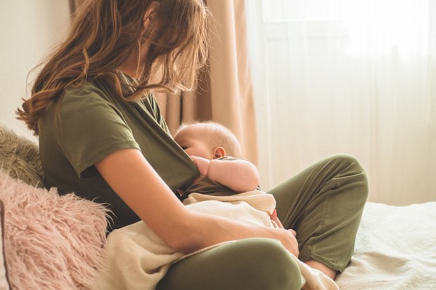 A mum breastfeeding her baby