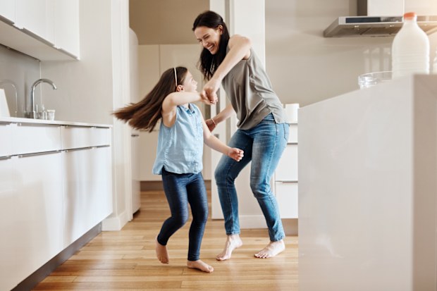 Girl dancing with her mother