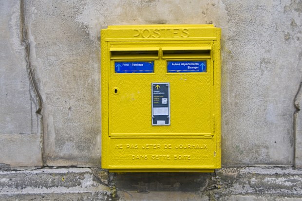 "Mailbox affixed to wall in Paris, France"