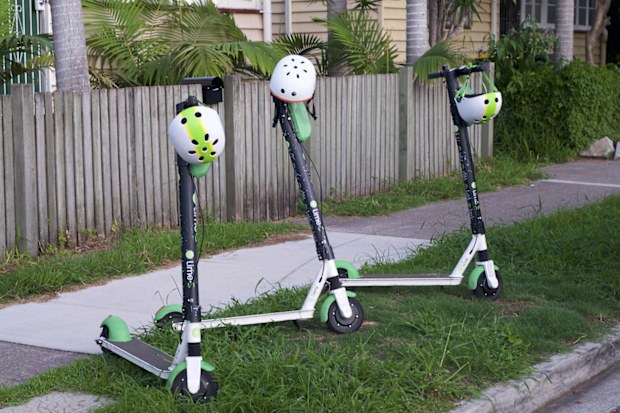 Brisbane, Queensland, Australia - 28th January 2020 : View of some Lime Electric Scooters parked on the sidewalk in Brisbane. This E-scooters used for transportation around the cities