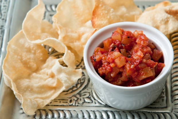 Pappadams and pineapple chutney which often belong to an Indian menu.