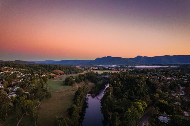 An aerial view of Ngali village in Australia, with the Bellinger River flowing through it
