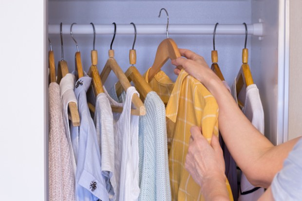 Woman at wardrobe with clothes