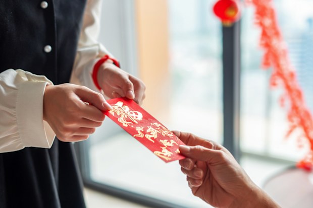 Chinese Culture in Chinese New Year, red envelope (Hong Bao) giving to bestow happiness and blessing to the receivers.