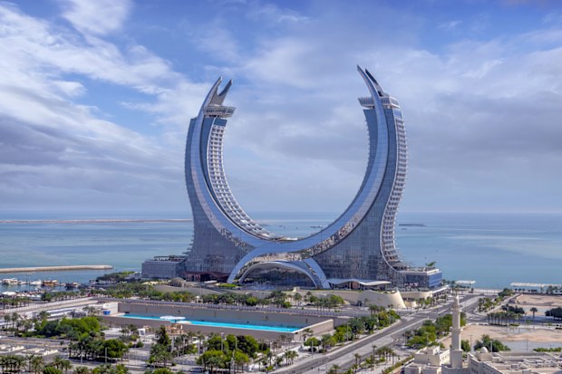 Lusail, Qatar - October 28, 2023: Katara buildings view from Lusail Marina Park. Crescent Tower Raffles Doha
