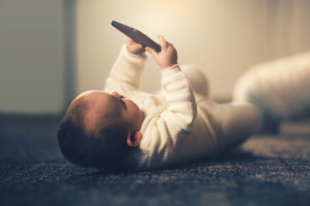 Baby holding a smartphone 