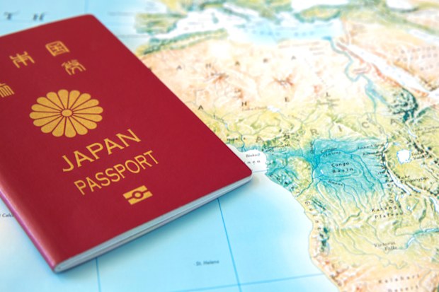 Japanese passport on a world map