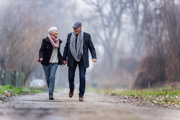 Couple having fun while holding hands.