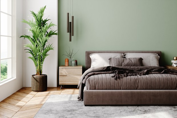 Interior of a modern bedroom decorated with modern furniture with pastel tones.