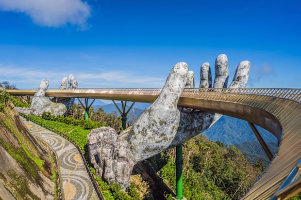Famous tourist attraction - Golden bridge at the top of the Ba Na Hills, Vietnam.