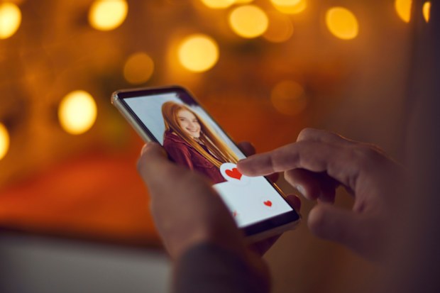 Man scrolling on dating app