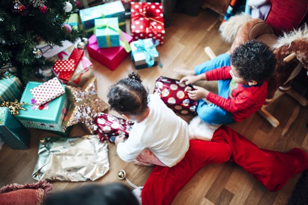 Christmas morning, siblings opening presents