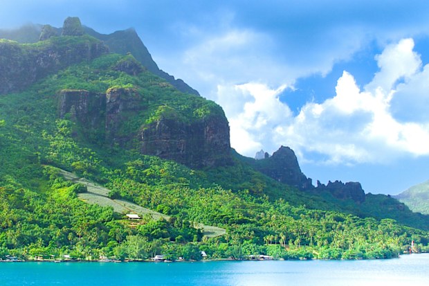 Moorea, French Polynesia - 2001: A view of the lush mountain island of Moorea in French Polynesia with blue clear water on the rare Canon EOS 1N - Kodak DCS 520, one of the first professional digital cameras.