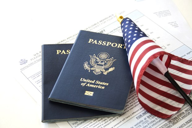 US Passports with flag and renewal forms