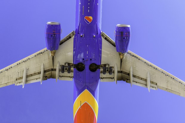 Las Vegas, USA - February 15, 2017: Commercial passenger jet airplanes approaching McCarran International Airport at Las Vegas for landing . Mccarran airport is one of the busiest airport in west coast and Las Vegas is known for best entertainment and gambling city in the world.