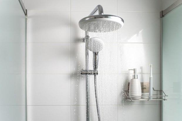 shower flowing water toiletries on shelf