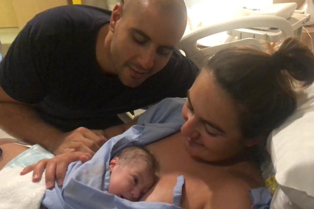 Nikolina Kharoufeh with husband Nicholas and son Noah moments after he was born. 