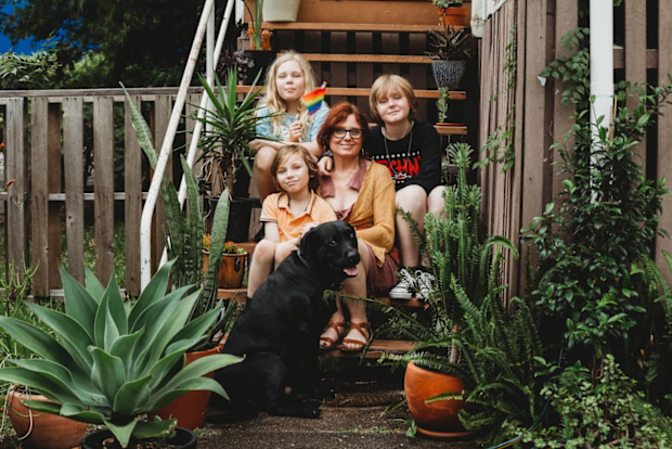 Rebecca Rushbrook with her three children and the family's dog.
