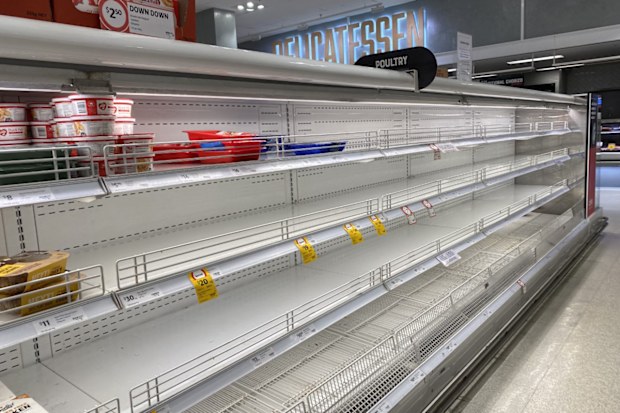 Empty supermarket shelves at Coles