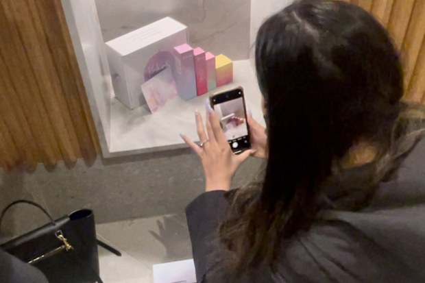 Cindy Lim snaps a photo of Koko&Kush products in store.