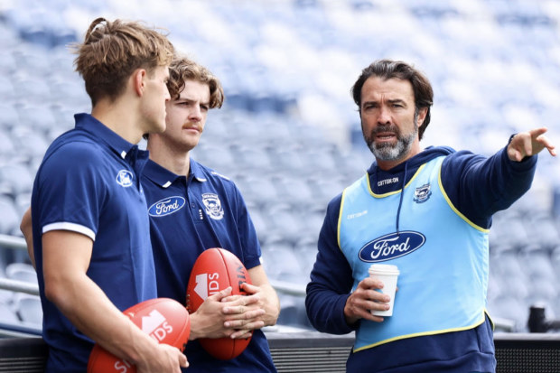 Cats new recruits with coach Chris Scott.