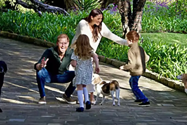 The Duke and Duchess of Sussex Prince Harry and Meghan with their children Prince Archie and Princess Lilibet, and their three dogs, pictured on the 2024 Christmas card.