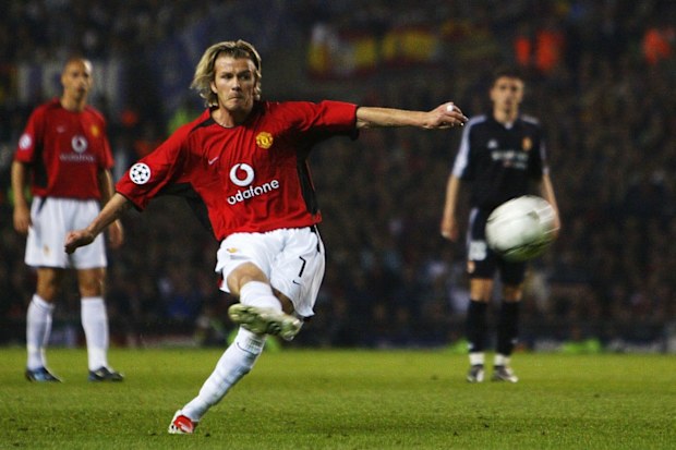 David Beckham of Man Utd scores the third goal from a free kick.
