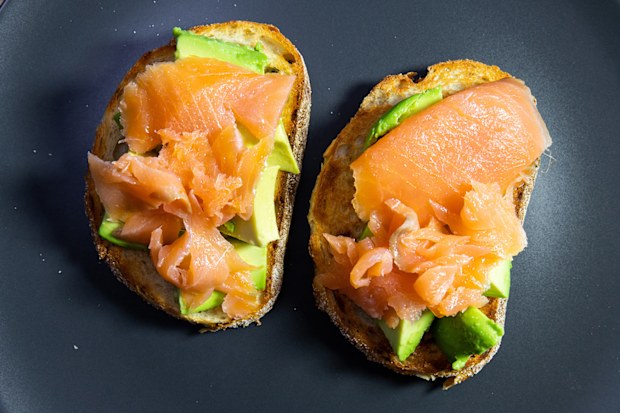 Smoked salmon and avocado on toasted sourdough bread.