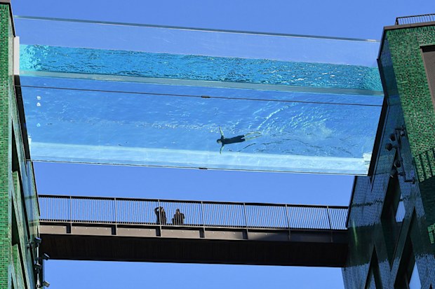 The transparent 25-metre-long outdoor pool, known as the Sky Pool, will allow residents to swim from one building to the other, 10 stories above the ground.