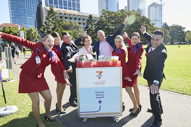 Virgin Australia CEO and cabin crew pictured at The Domain, Sydney, for the launch of their new 7 Eleven partnership.