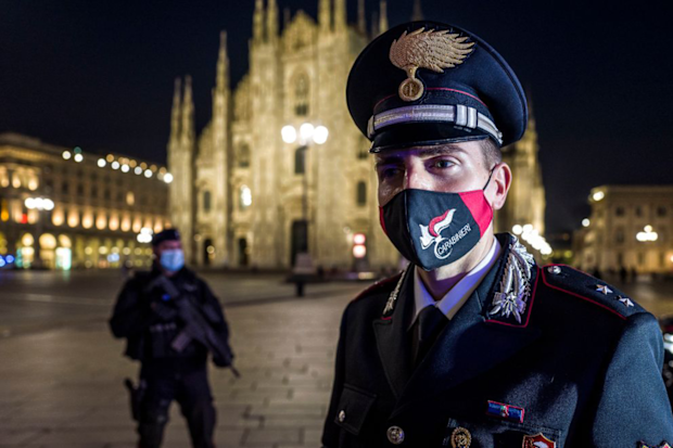 Carabinieri in Piazza Duomo in Milan do compliance checks for new COVID-19 regulations on the first day of lockdown.