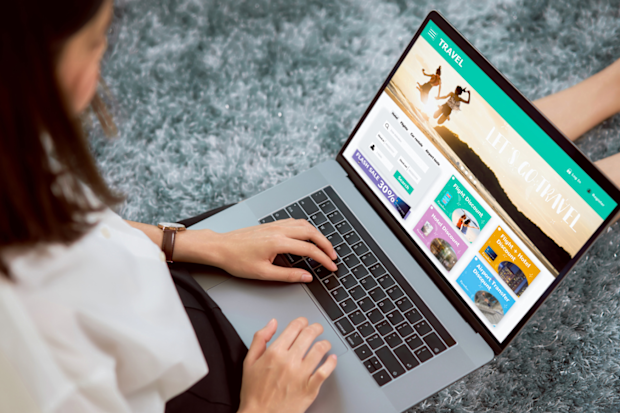 Woman booking a holiday on a computer / laptop