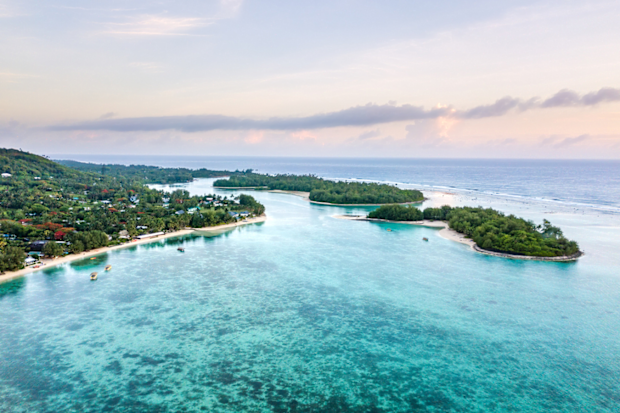 An aerial view of Muri Lagoon at sunrise in Rarotonga in the Cook Islands