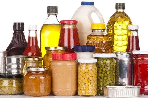 Large group of canned food sitting on white backdrop