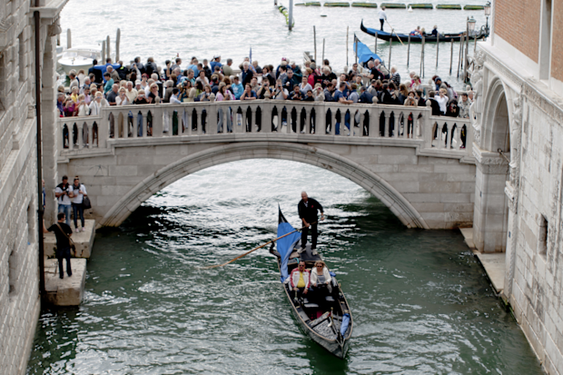 Venice overtourism: bridge crowded with tourists