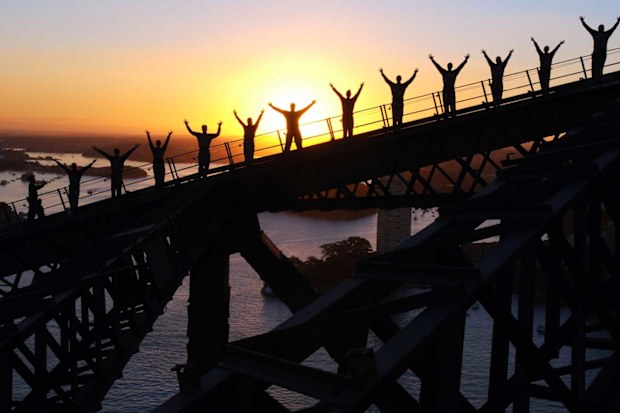 BridgeClimb Sydney -- climbers scaling the Sydney Harbour Bridge at dawn