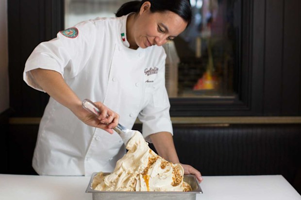 Anna Temellini, product innovation specialist for Gelatissimo. Woman scooping gelato