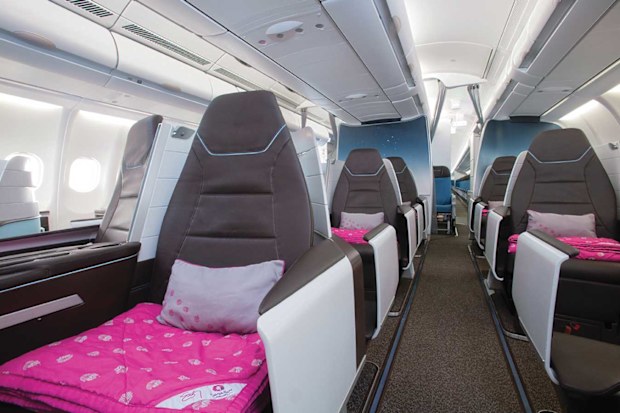 Hawaiian Airlines business class cabin with lie-flat seats A330