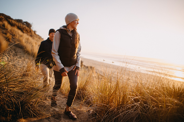 Couple on a coastal walk in the sunshine